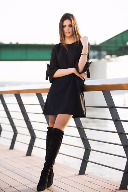 istock beautiful woman standing by the river 654604622