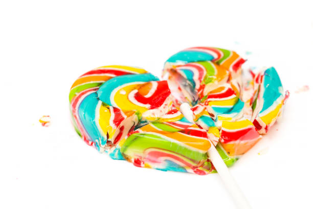istock Colorful retro style heart shape lollipop isolated on white background 654604750