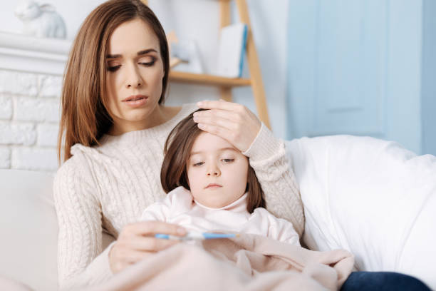 istock Troubled caring mother curing her daughter 654621568