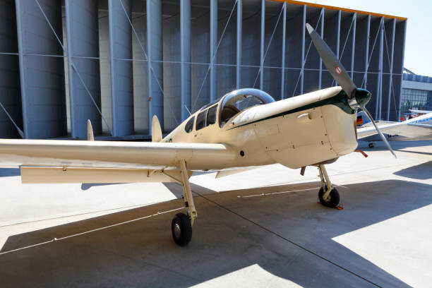 Hamburg, Germany - August 22, 2015: Rare vintage aircraft, Miles M-38 Messenger 2A exposed at the Hamburg Airport Days 2015. Modern airport hangar in the background.