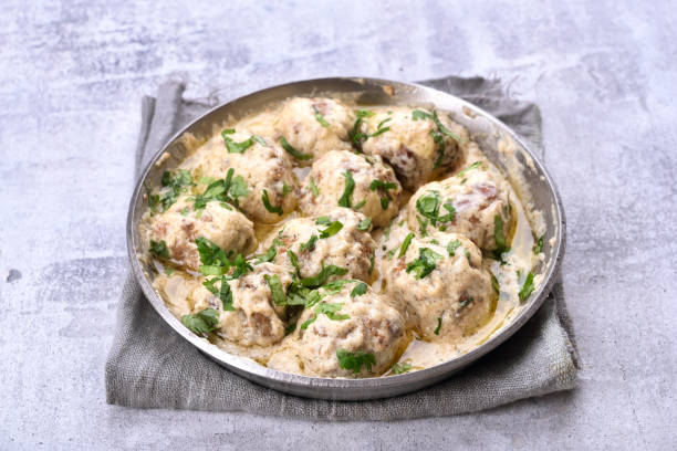 istock Meatballs with white sauce and green herbs 654627654