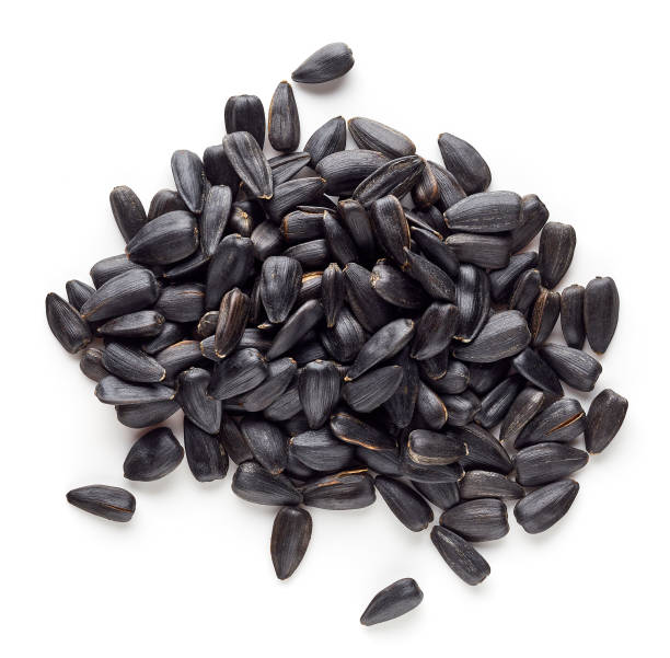 istock Heap of black sunflower seeds from above 654634032