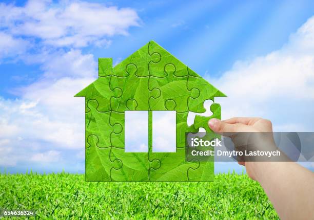Eco House Concept Hand Build House From Puzzle Stock Photo - Download Image Now - House, Sustainable Energy, Agricultural Field