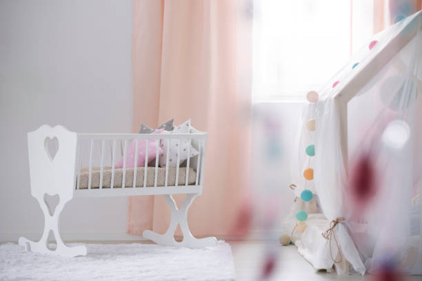 istock Crib in baby room 654636386