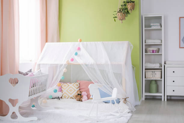 istock Playhouse with canopy in baby room 654636462