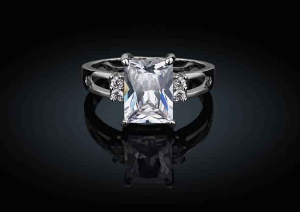 istock jewelry ring with big square diamond on black background with reflection 654636612