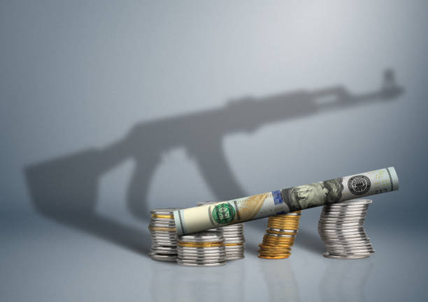 military budget concept, money with gun shadow - terrorism imagens e fotografias de stock