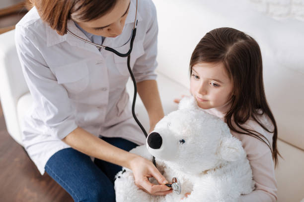 istock Pleasant doctor examining fluffy toy 654644004