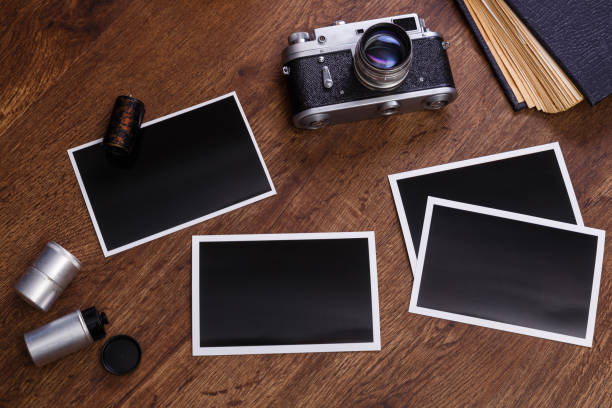 istock Vintage photo camera. Blank photo frames. 654647762