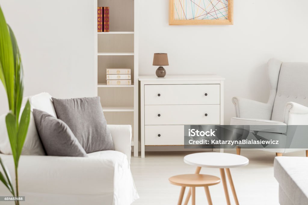 White cozy room White cozy living room with sofa and armchair in nursing home Common Room Stock Photo