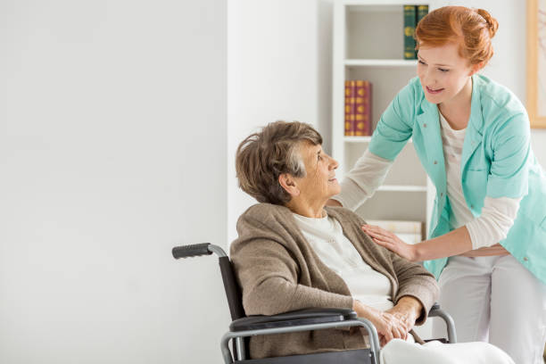istock Caregiver in nursing home 654651598