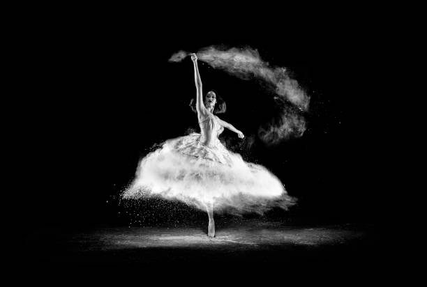 istock Beautiful ballet dancer, dancing with powder on stage 654659098