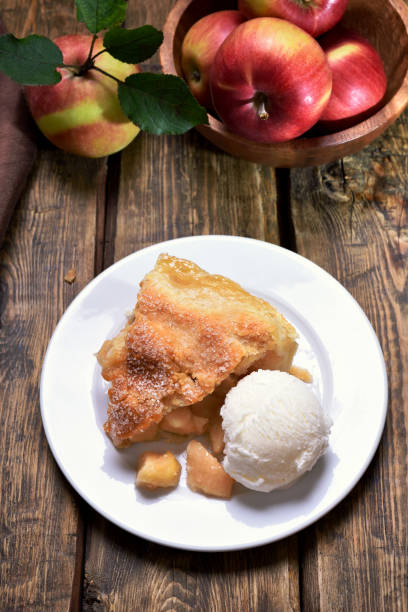 istock Piece of apple pie served with ice cream 654659560