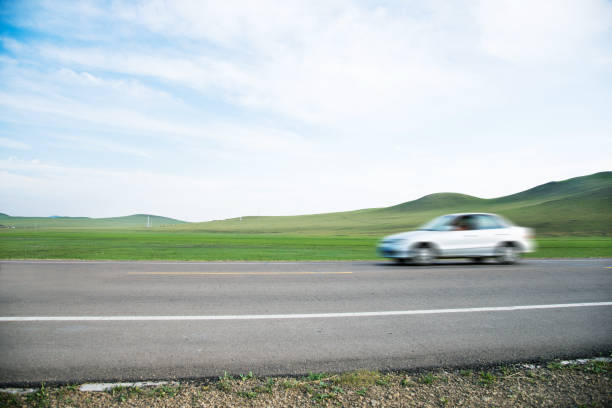 Car driving fast on the road