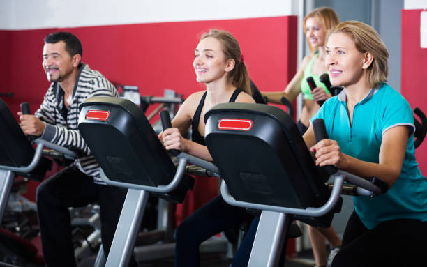 istock Fitness group riding stationary bicycles 654694762