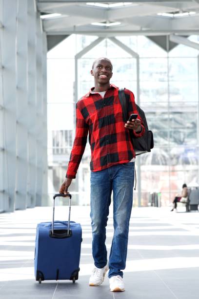 istock Happy young guy at airport 654703850
