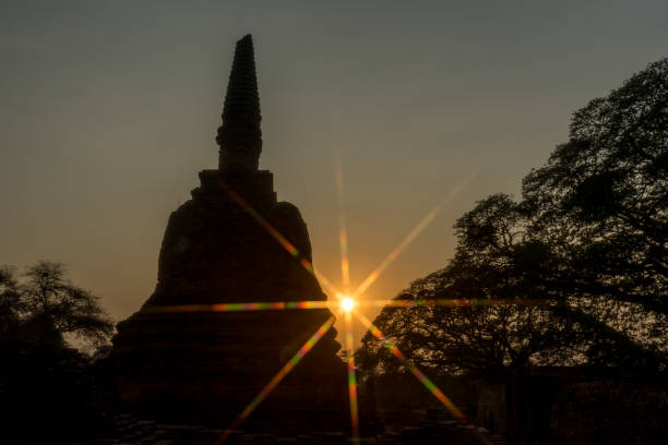 istock Silhouette Pagodas with sun stars 654703956