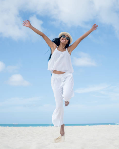 istock Happy woman at the beach 654709636