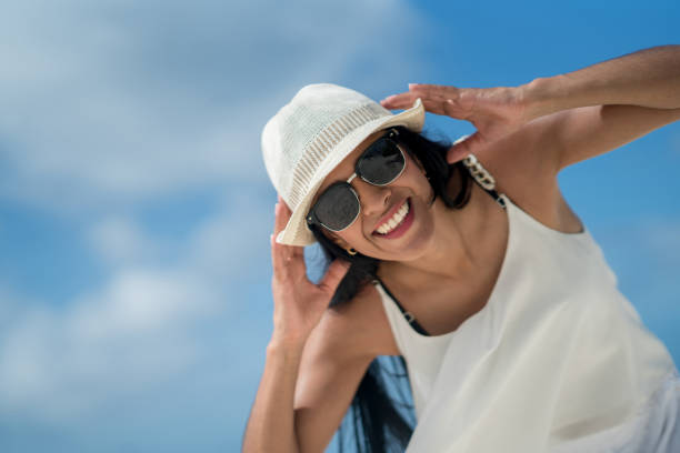 istock Happy woman on vacations at the beach 654709704