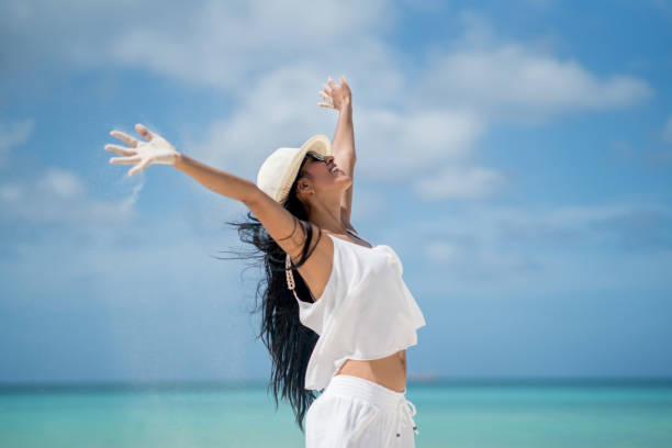 istock Woman enjoying her vacations at the Caribbean 654709710