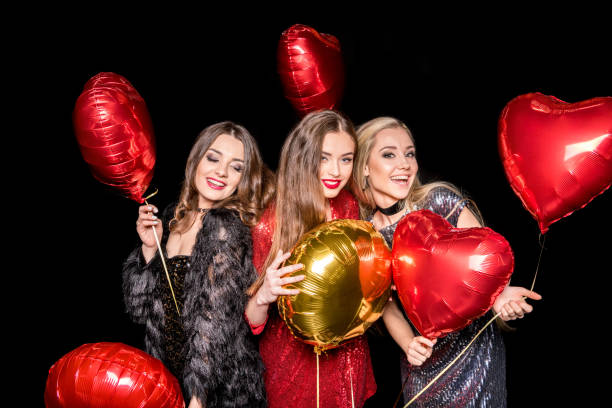 istock Gorgeous women with balloons 654709738