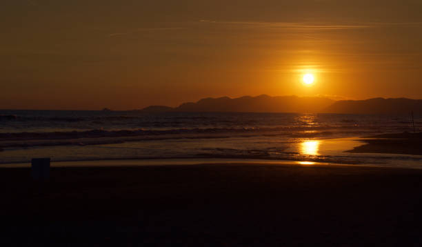 istock Sunset over an Italian beach. 654710110