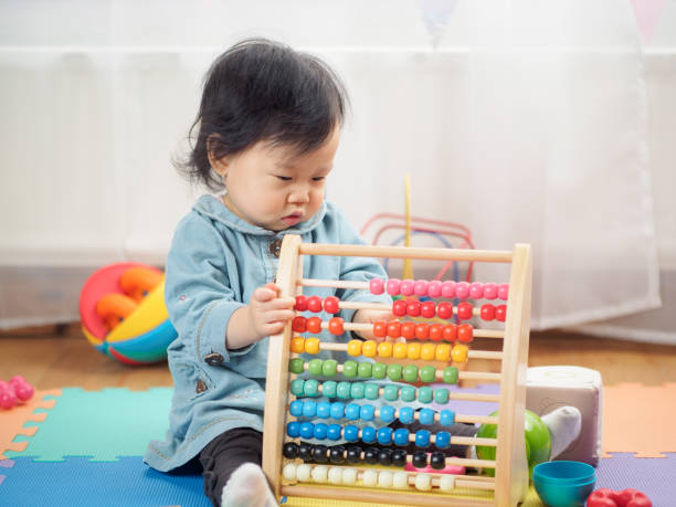 istock Baby girl play abacus at home 654710364