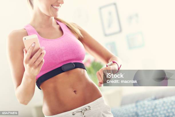 Sports Woman Using Smart Watch And Checking Her Heart Rate Stock Photo - Download Image Now