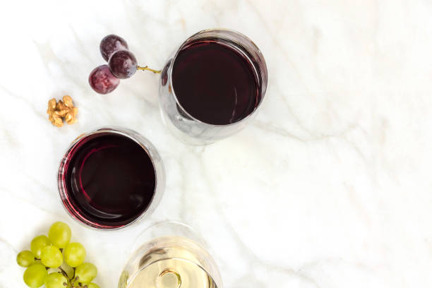 istock Glasses of red and white wine at tasting 654715658