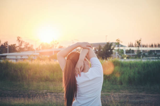 istock Women exercising in sunny bright light.in park 654718018