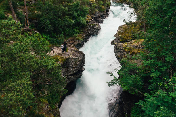 istock Tourists enjoying view of Slettafossen waterfall 654722340