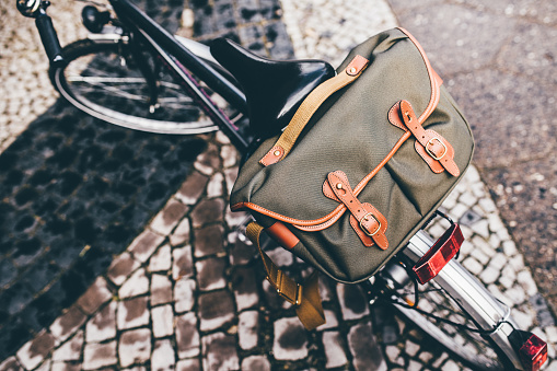 Retro bike with retro styled bag on the old street