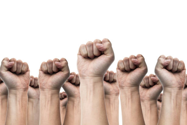 istock united people, labor movement, worker strike, election movement, protest illegal election concepts with males fist raised air fighting for their rights, isolated on white backgrounds 654722722