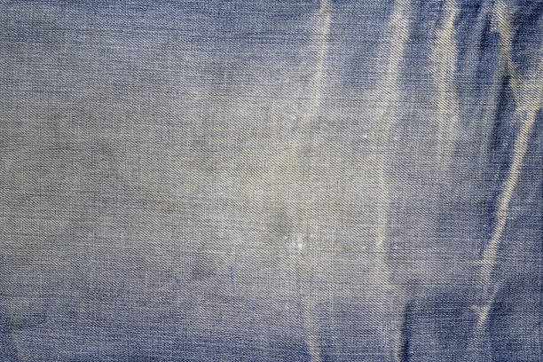 istock Texture of blue jeans textile background 654729410