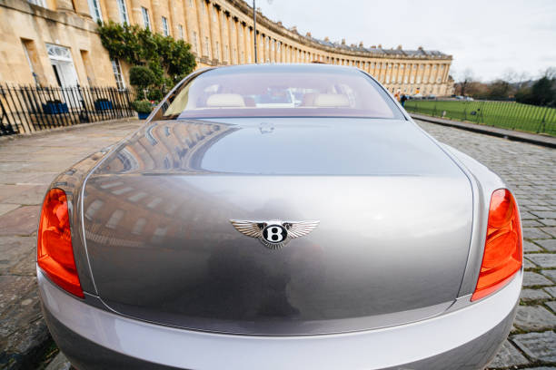 Bentley Mulsanne limousine car with the Royal Crescent luxury Building complex Rear view of luxury Bentley Mulsanne limousine car with the Royal Crescent luxury Building complex in Cheltenham, England bath abbey stock pictures, royalty-free photos & images