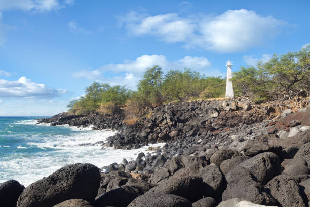 istock white concrete lighthouse on rocky Hawaii shore 654733856