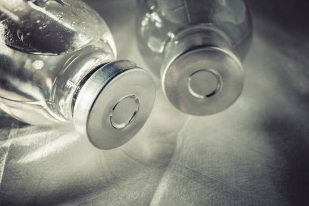 istock Glass medicine vials with liquid. 654734590