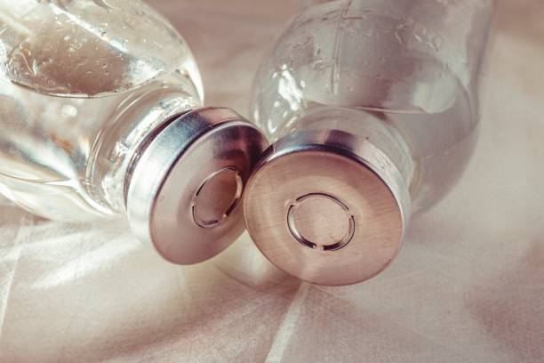 istock Glass medicine vials with liquid. 654734594