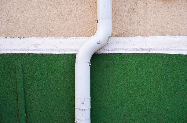istock Close-Up Of Water Pipe Against Wall 654735089