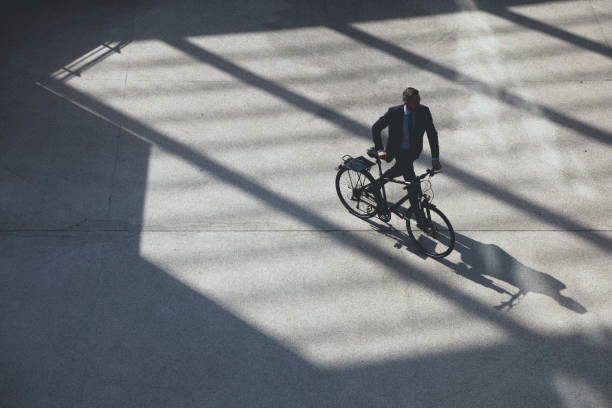 istock overhead view on Businessman with bicycle 654736976
