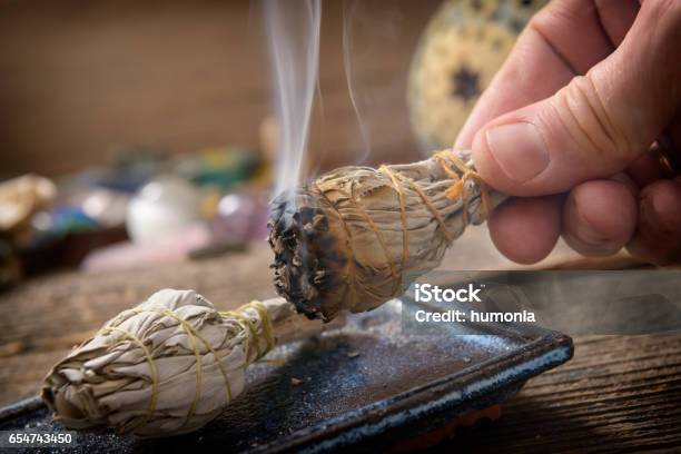 Man Burning White Sage Incense Stock Photo - Download Image Now - Smudged - Condition, Smudge Stick, Ceremony