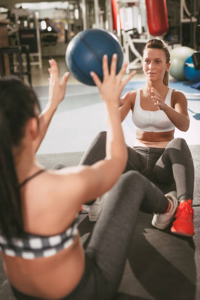 istock Two Girl Exercising At The Gym 654744510