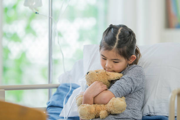 istock Little Girl Holding Her Teddy Bear 654745080