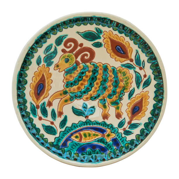 istock Covered with glaze ceramic plate handmade. Isolated on a white background 654748346
