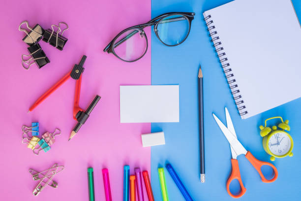 istock Flat lay, top view office table desk. feminine desk workspace with succulent, laptop, glasses, diary on pink and blue background. 654750928