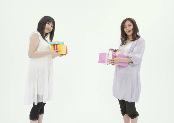 istock Young woman with a gift 654751640