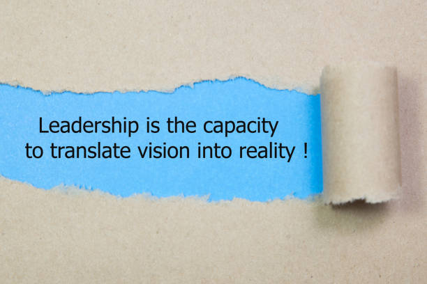 istock Leadership is the capacity to translate vision into reality written under torn paper 654751766