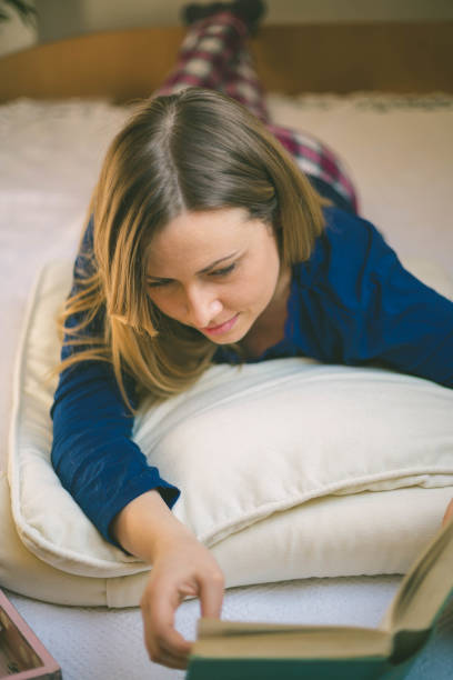 istock Beautiful woman lying in bed 654767726