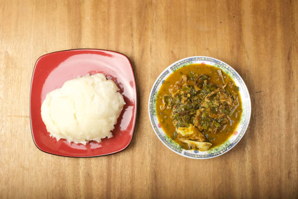 A plate of fufu served with oha soup An african staple meal african culture food stock pictures, royalty-free photos & images