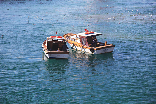 Photo of two small fishing boats moored on the bosphorus on May 02, 2012 in Kadikoy, Istanbul, Turkey.
